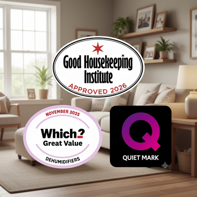 Three decorative badges or stickers on a plain gray background: an oval white badge reading 'Good Housekeeping Institute Approved 2026' with a red star and red text, a round white badge with a pale pink border reading 'Which? Great Value Dehumidifiers November 2025', and a black square badge with a purple-to-pink 'Q' and the words 'QUIET MARK'.
