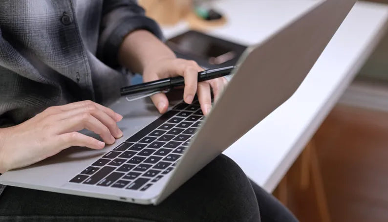 Customer registering warranty on laptop